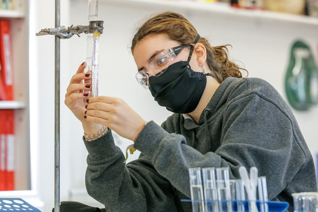 TEMS student with science equipment